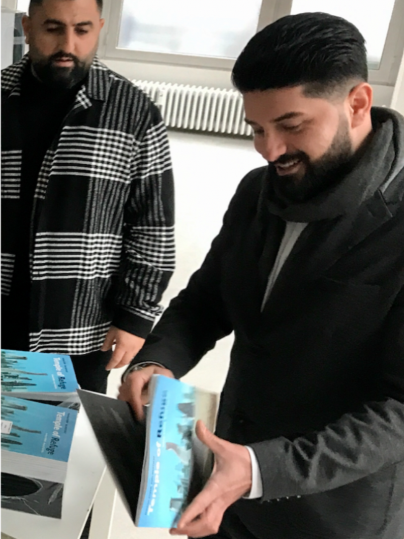Sartep Namiq and translator Anwar Mohamad at the delivery of the comic he commissioned