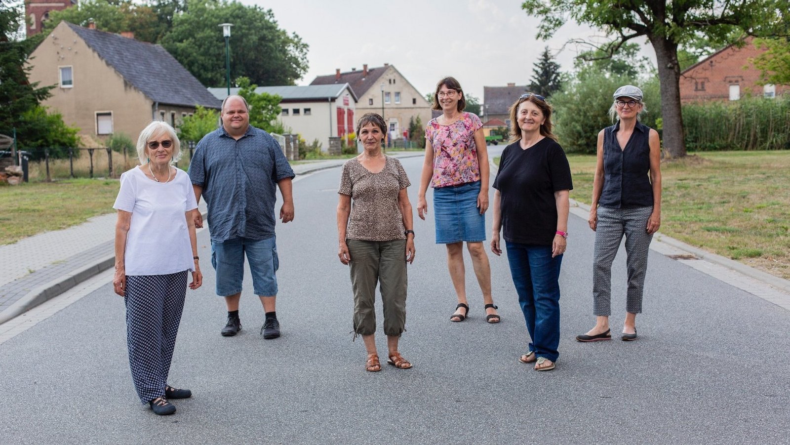 Group of The New Patrons of Steinhöfel standing in the village 